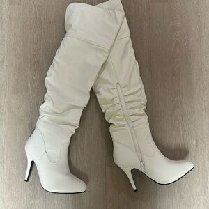 Knee high white stiletto boots